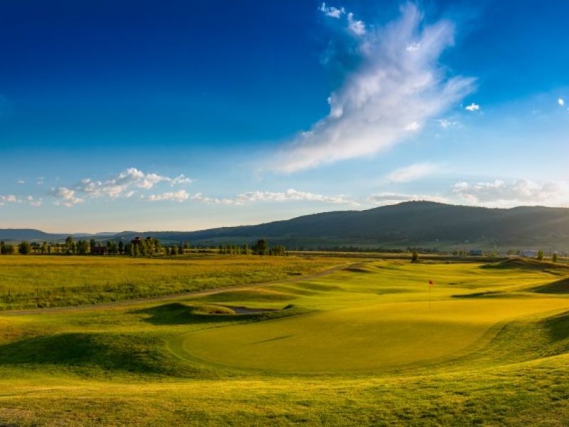 Panoramic golf hole at sunset
